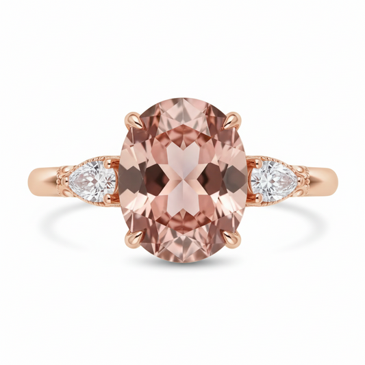Rose gold ring with a large pink gemstone and smaller white gemstones on a white background